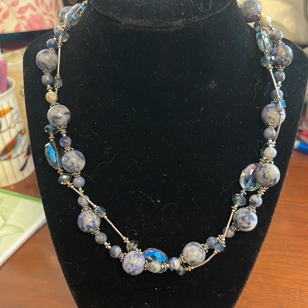 Double strand twisted silver, blue, and lapis colored necklace.  18”.